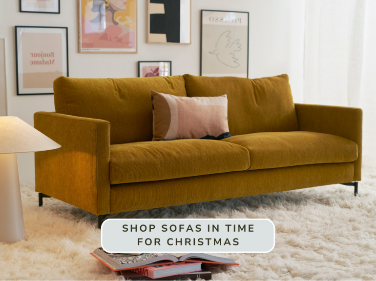 Mustard yellow sofa on cosy sheepskin rug Mustard yellow sofa on cosy sheepskin rug